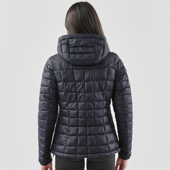 A women's puffer jacket in navy blue with a quilted design and a hood, viewed from the back.