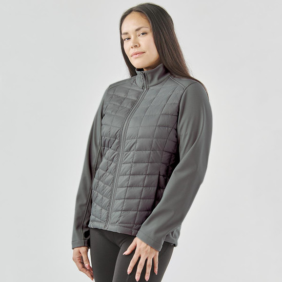A women's thermal softshell jacket in grey, featuring a quilted front and long sleeves with a zip front.