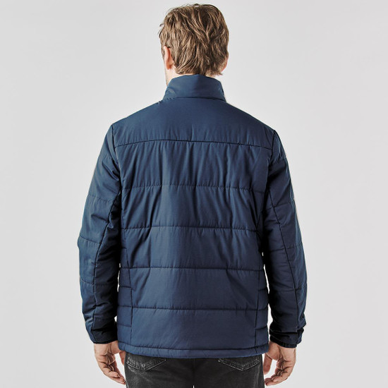 A thermal puffer jacket in navy, featuring a quilted design and a high collar. It has a logo on the exterior.