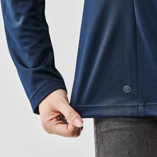 A close-up of a navy blue women's pullover featuring long sleeves and a subtle logo at the hem.