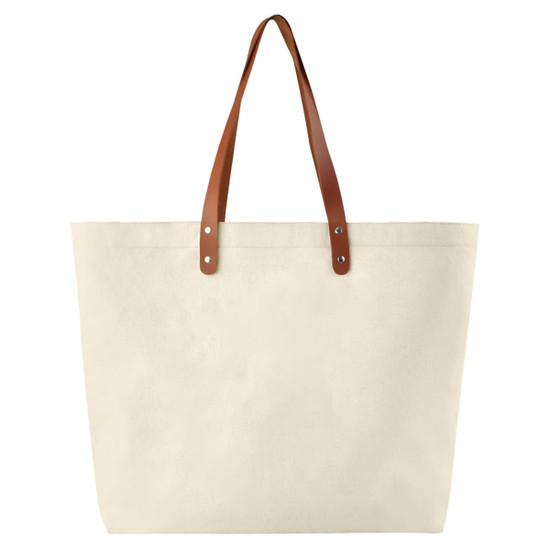 A beige cotton tote bag with brown leather handles and metal studs, featuring a simple design.