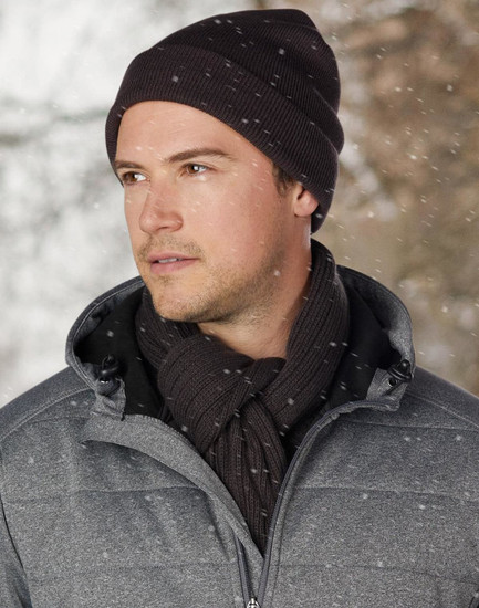 A red acrylic beanie with a ribbed texture and a rolled brim. It features a branding logo.