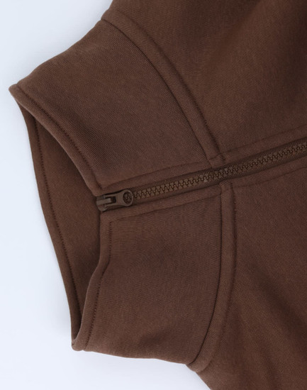 A brown 1/2 zip collar polar fleece jumper featuring a zip on the neckline. It has a smooth texture and a logo.