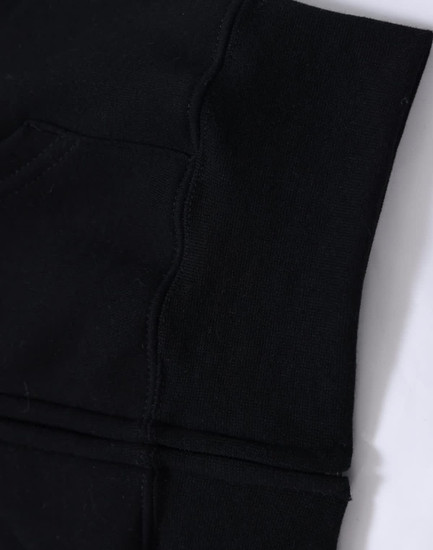 A black fleece hoodie featuring a full zip, showing the cuff and pocket detail. Includes a logo.