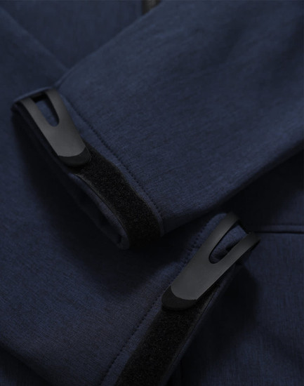 A close-up of a navy softshell hoodie featuring cuff details and a logo.