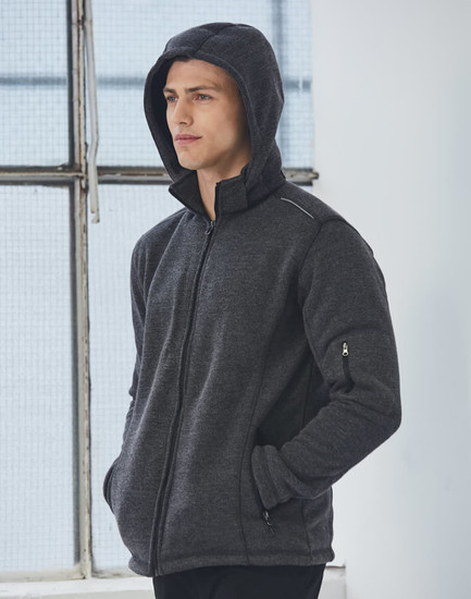 A men's heather bonded fleece jacket in dark grey, featuring a hood and zippered pockets, with a logo on the sleeve.