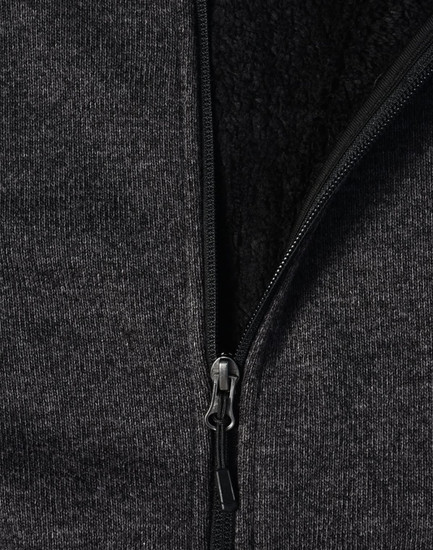 A ladies' grey bonded fleece jacket featuring a zip closure and soft inner lining. It includes a logo on the fabric.