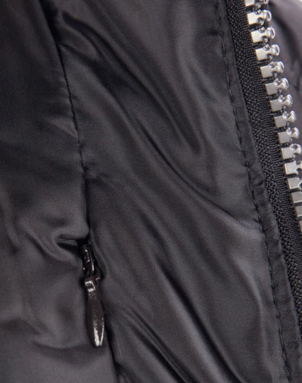 A close-up of a heavy quilted black puffer jacket featuring a zip and a side pocket. It has a logo on the front.