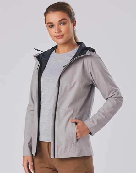A grey ladies' waterproof performance jacket with a black hood, featuring a logo and zippered pockets.