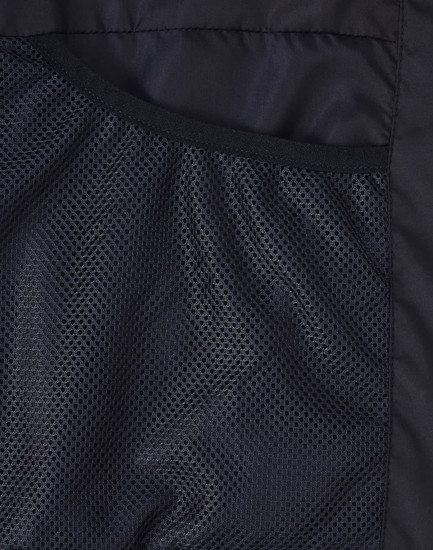 A close-up of the interior lining of a black sustainable parka jacket featuring a mesh texture.