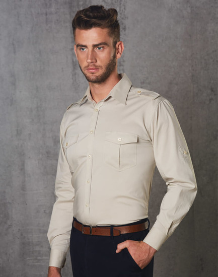 A men's long sleeve military shirt in beige, featuring two front pockets and a logo on the shoulder.