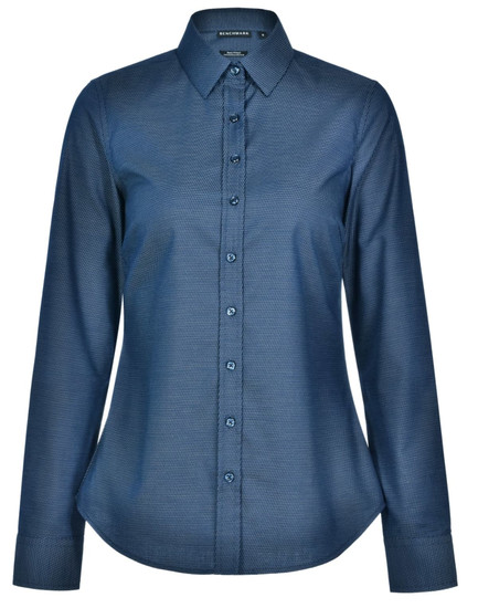 A long-sleeved, button-up shirt in dark blue with a pin dot pattern and a collar. It features a logo on the label.