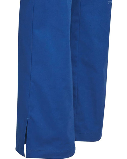 A pair of blue solid colour scrub pants with side slits at the hem, featuring a brand logo.