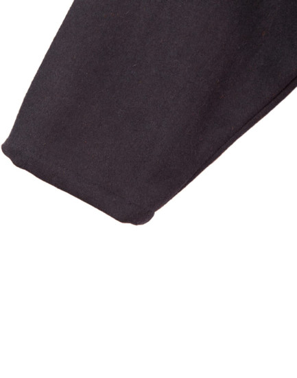 A close-up of a black fabric sleeve, showcasing the texture of the material.