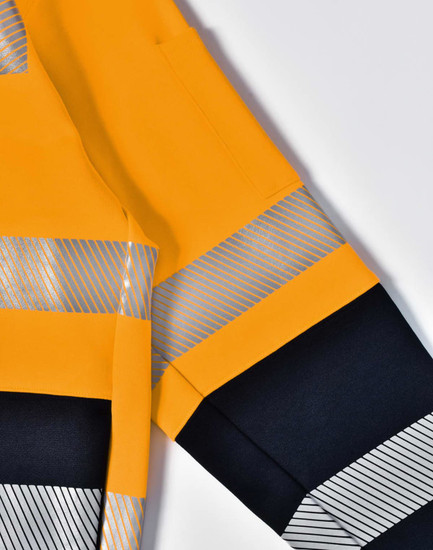 A bright yellow work jumper featuring reflective stripes and a dark navy blue lower section. Includes a logo.