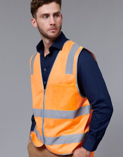 An orange safety vest with reflective stripes worn over a dark blue shirt, featuring a pocket and a logo.