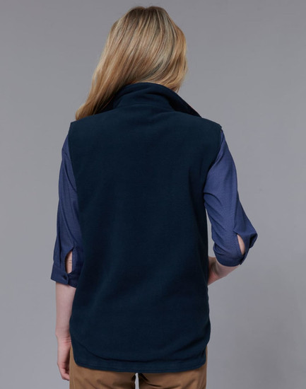 A navy reversible safety vest with a snug collar, shown from the back, paired with a blue shirt underneath.