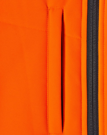 A close-up of an orange fabric featuring a zippered pocket, part of a safety jacket design.