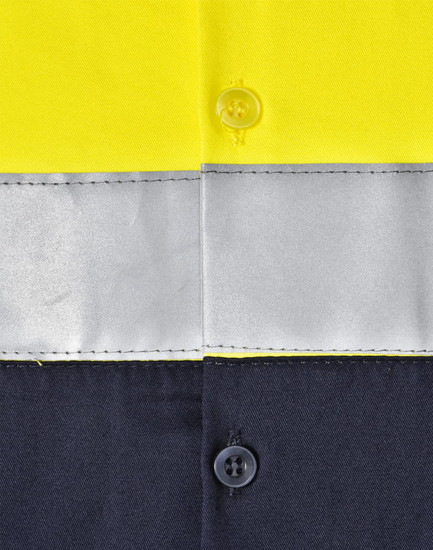 A high-visibility long-sleeve safety shirt featuring yellow fabric with grey reflective tape and dark navy sections.