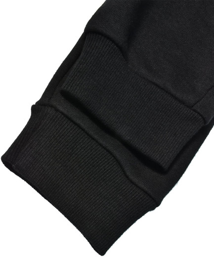 Black poly/cotton terry sweat pants featuring ribbed cuffs and a soft fabric finish. Includes a logo on the waistband.