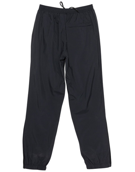 Black track pants with a drawstring waist and a back pocket, featuring elasticised cuffs and a simple design.