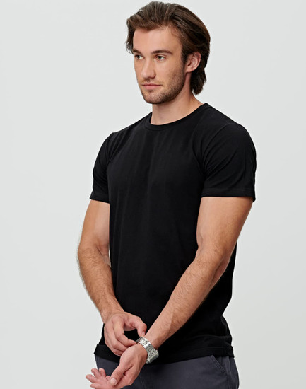 A black men's premium cotton tee displayed on a model, featuring short sleeves and a standard fit.