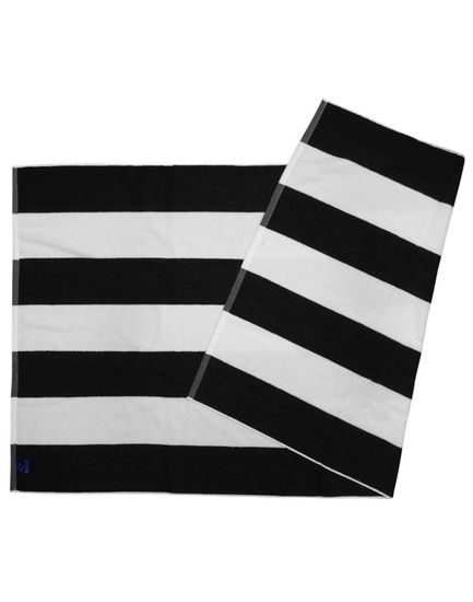 A striped beach towel in black and white with a logo, featuring alternating bold stripes.