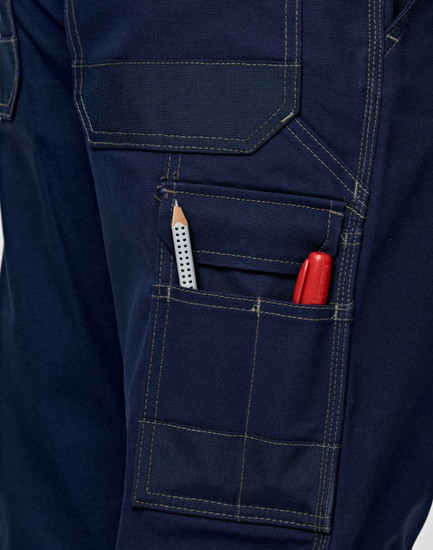 Light weight semi-fitted Cordura work pants in navy, featuring pockets with a pencil and marker visible. Includes a logo.