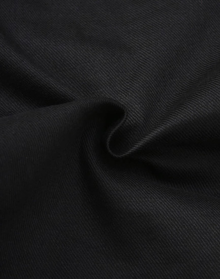Black cotton stretch ripstop fabric featuring a textured weave, suitable for workwear applications.