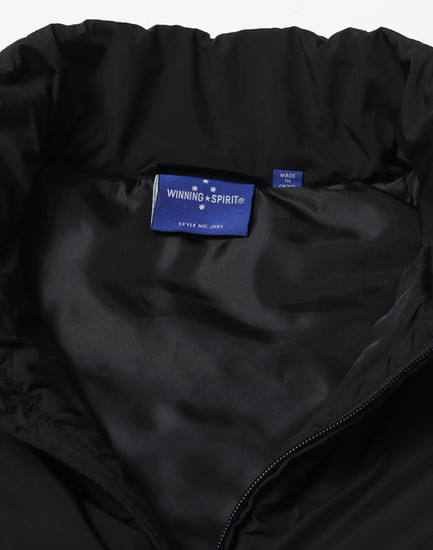 A black insulated puffer vest featuring a smooth inner lining and a logo tag inside the collar.