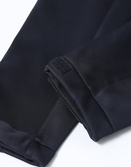 A close-up of the cuffs of a black ladies' sustainable softshell corporate jacket with a velcro detail.