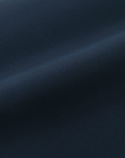 A smooth, dark navy fabric with a sleek finish, showcasing a quilted texture. It has a subtle sheen.