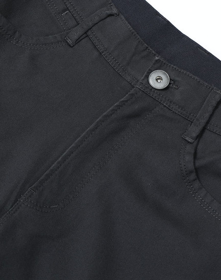 Black men's chino pants featuring a flexible waistband and button closure, with detailed stitching and pockets.