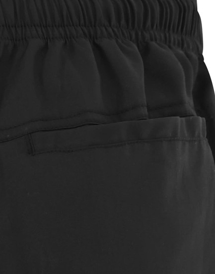 Black unisex mercerised cotton shorts featuring an elastic waistband and a side pocket. Includes branding on the fabric.