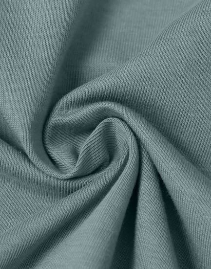 A close-up of a soft, lightweight, textured fabric in a muted teal colour, showcasing its smooth surface and drape.