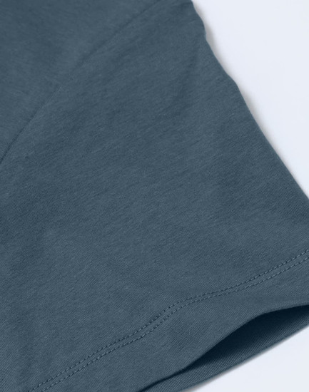 A men's premium cotton short-sleeve T-shirt in a soft blue shade, featuring stitched detailing and a logo.