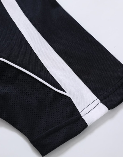 A black polo shirt with white stripes along the seams and a logo on the fabric.