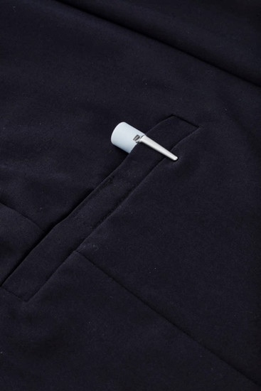 A navy women's comfort waist cargo skirt featuring a side pocket and a hanging tag.