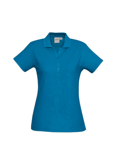 A blue ladies polo shirt featuring a collar and button placket, with a logo on the fabric.