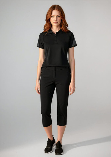 A women's black short sleeve polo shirt displayed with matching black pants, featuring a logo on the polo.
