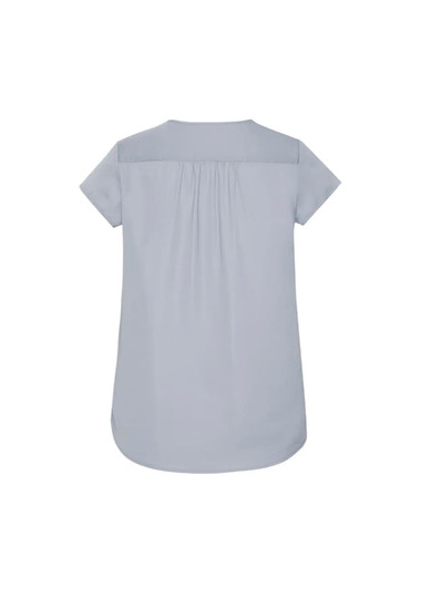 A light blue women's blouse featuring a V-neck and pleat detailing at the back. Includes a logo.