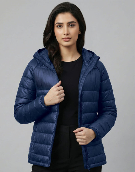 A lightweight hooded puffer jacket in navy blue, featuring a zip front and a branded logo.