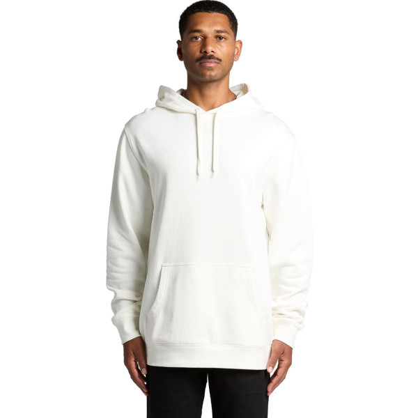 A man wearing an organic, cream-coloured hoodie with a front pocket and a hood. The hoodie has a logo.