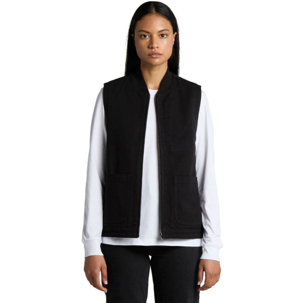 A black heavy vest with a zip front, featuring two front pockets, modelled by a person.