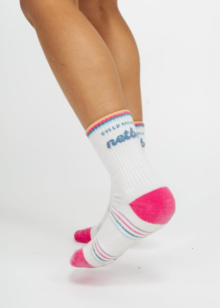 Custom branded kids' socks in white with pink and blue accents, featuring a logo on the ankle.