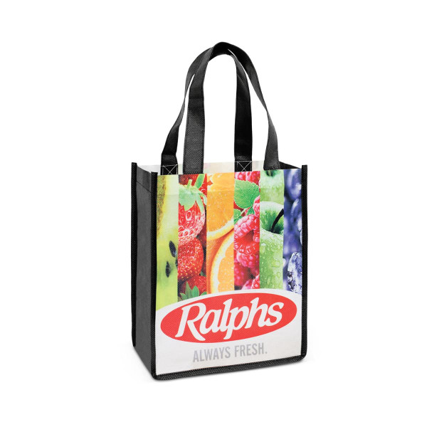 A tote bag featuring a colourful fruit design and black handles, with branding on the front.