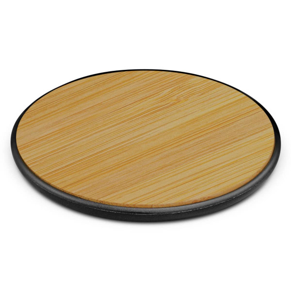 A bamboo wireless charger with a circular design and a black base, featuring a smooth wooden surface.
