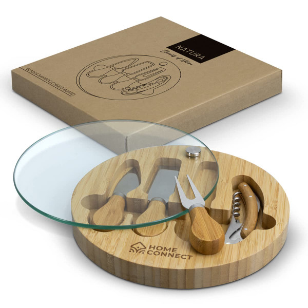 A bamboo cheese board with a glass top and wooden utensils, featuring a logo on the board.