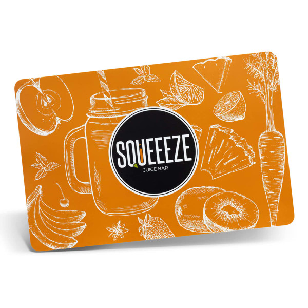 An orange full colour place mat featuring illustrations of fruit, vegetables, and a drink jar, with a logo.