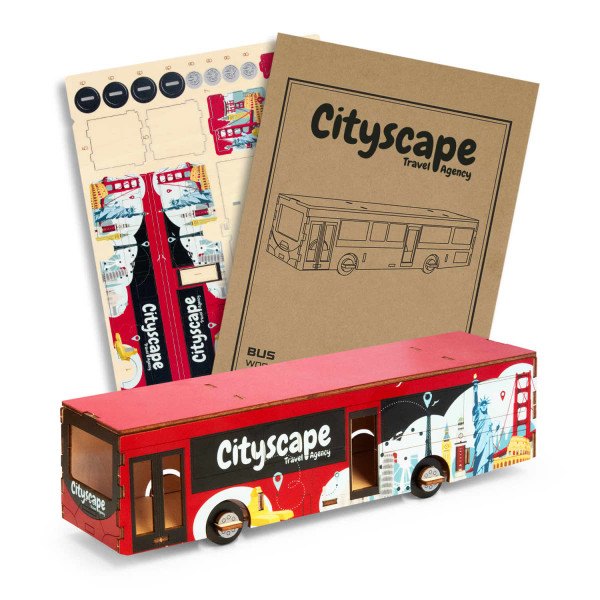 A wooden bus model in red and blue, featuring various city landmarks and a logo on the side, alongside design sheets.